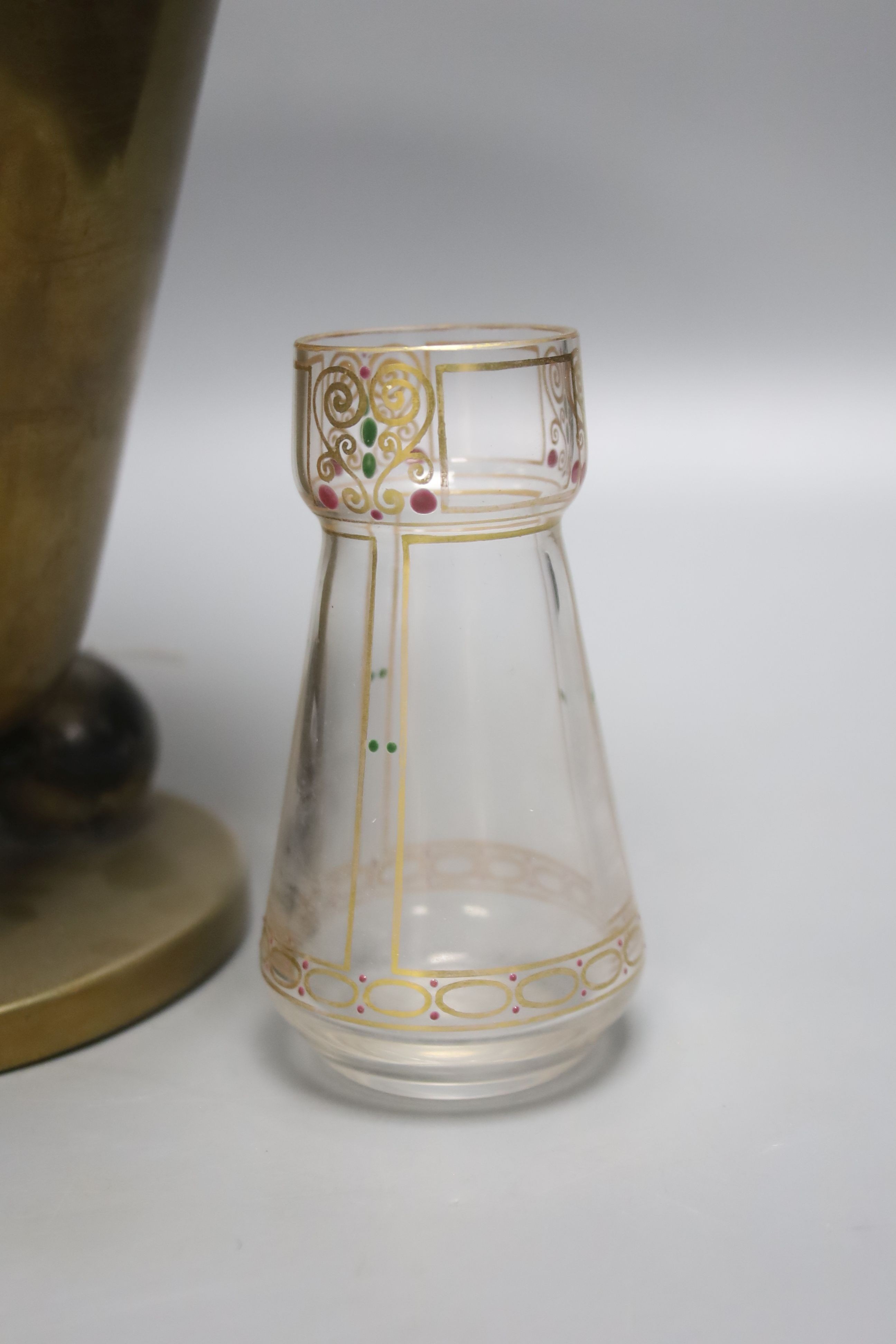 A Hoffman style brass vase and a small secessionist style glass vase, 24cm tall